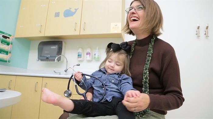 Dr. Knupp with a patient. Photo courtesy Children's Hospital Colorado Dr. Knupp at Children's Hospital Colorado
