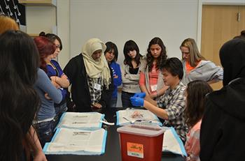 Students gathered around table