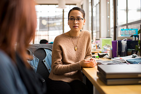 Woman consulting at desk